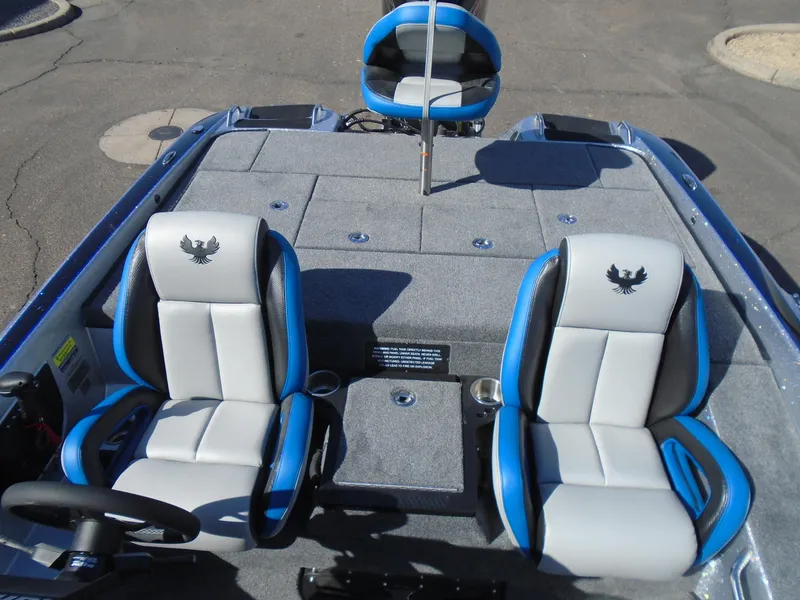 Slide: The Image of 2005 Phoenix 921 ELITE boat interior with blue and gray seating. - 8