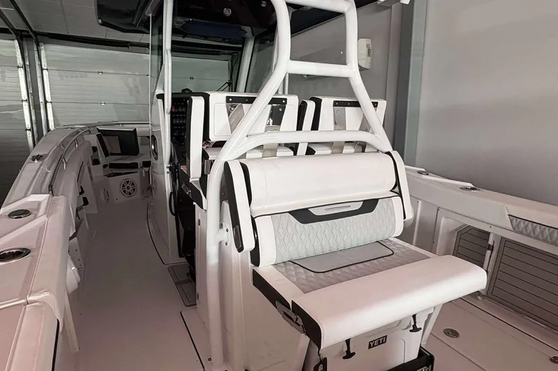 Slide: The Image of 2025 Blackfin 302 CC boat interior with white seating and modern design. - 12