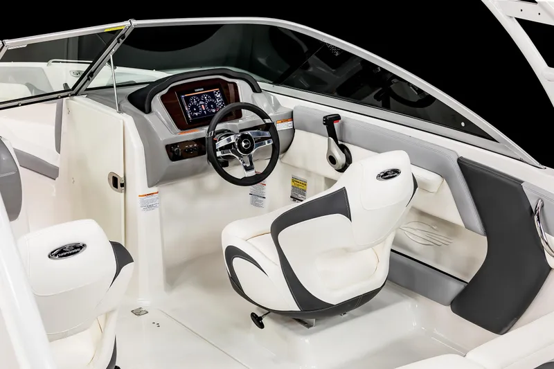 Slide: The Image of 2025 Chaparral SSI boat interior with modern dashboard and steering wheel. - 18
