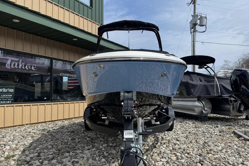Slide: The Image of 2025 Chaparral SSI boat on trailer outside dealership, front view. - 2