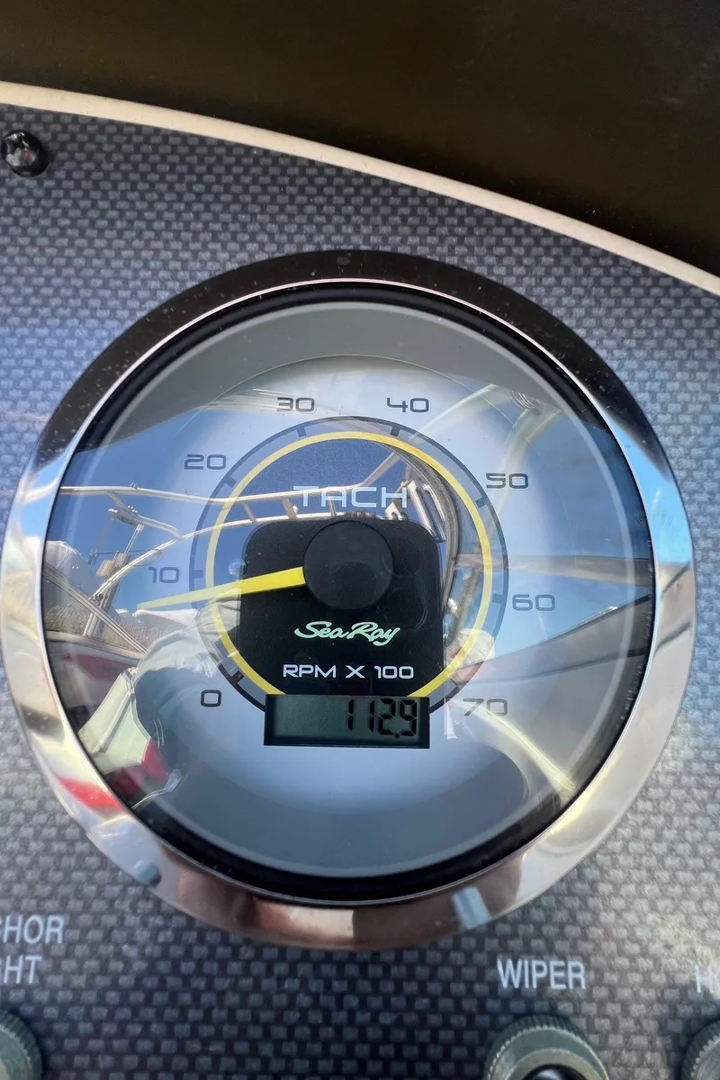 Slide: The Image of Tachometer of 2010 Sea Ray 205 Sport showing 1129 RPM. - 11