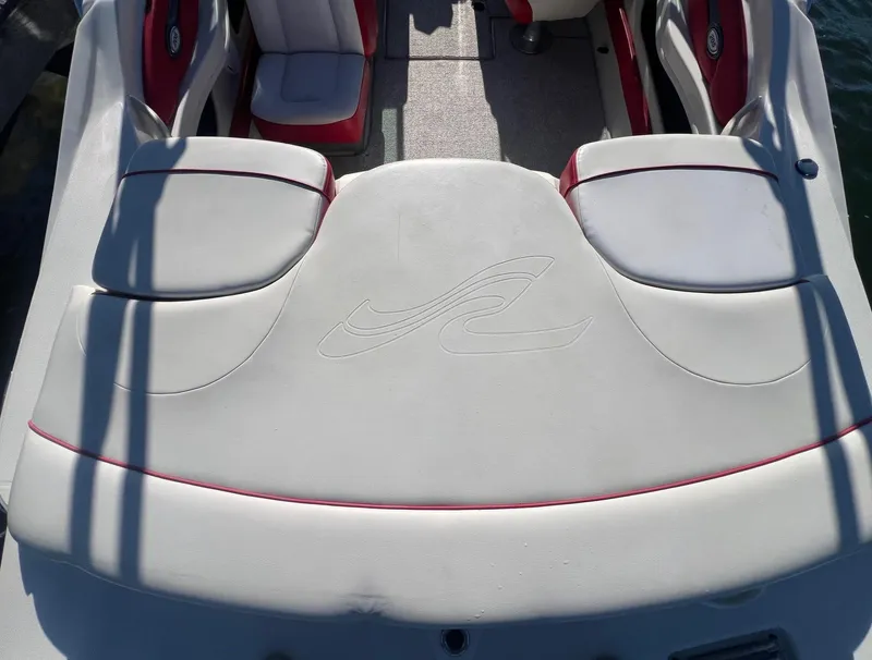 Slide: The Image of 2010 Sea Ray 205 Sport boat interior with white and red seating. - 4