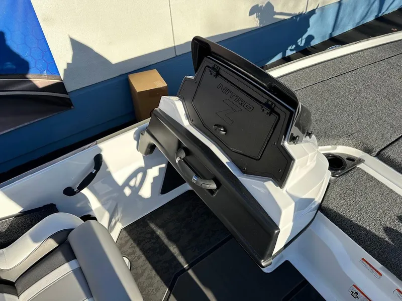 Slide: The Image of 2025 Nitro Z20 XL Pro boat storage compartment open, showcasing interior design. - 14