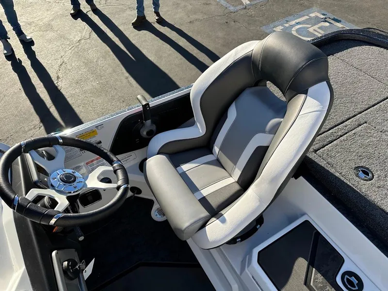 Slide: The Image of 2025 Nitro Z20 XL Pro boat cockpit with steering wheel and cushioned seat. - 15