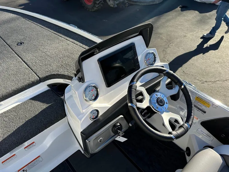 Slide: The Image of 2025 Nitro Z20 XL Pro boat dashboard with steering wheel and gauges. - 16