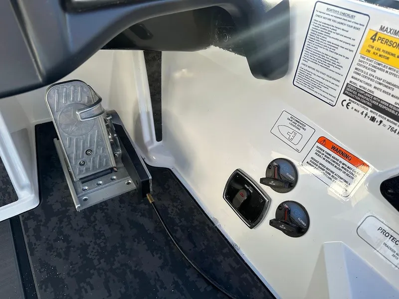 Slide: The Image of 2025 Nitro Z20 XL Pro boat controls and foot pedal with safety warnings. - 19