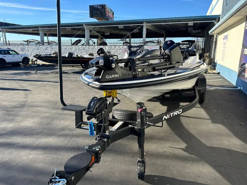 Slide: The Image of 2025 Nitro Z20 XL Pro boat on trailer in outdoor dealership lot. - 4