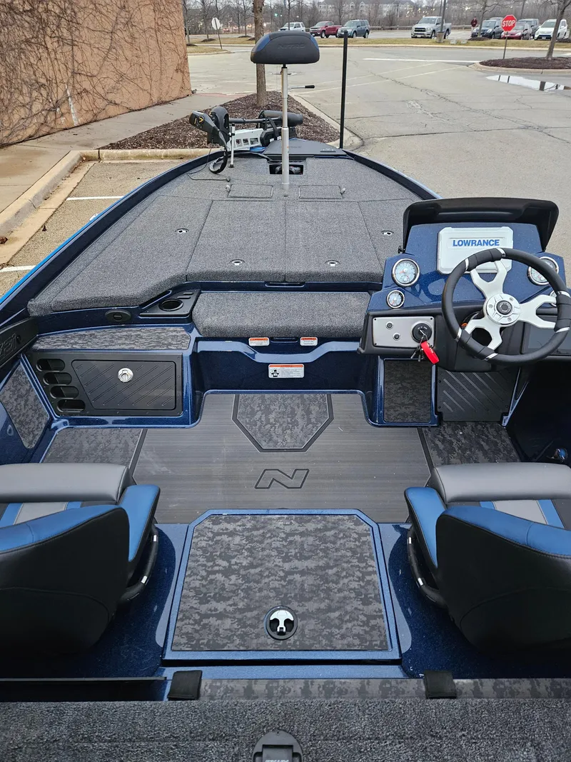 Slide: The Image of 2025 Nitro Z21 XL boat interior with modern dashboard and seating. - 2