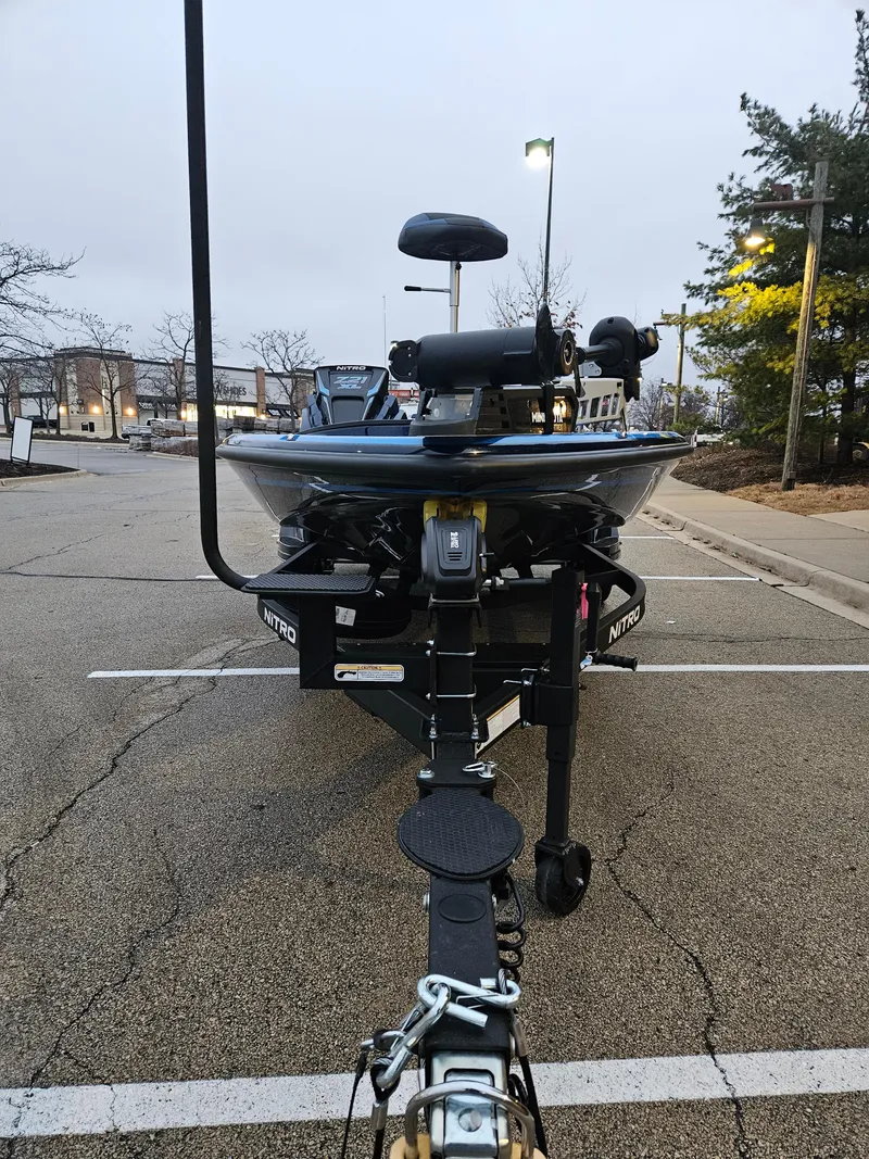 Slide: The Image of 2025 Nitro Z21 XL boat on trailer in parking lot. - 4