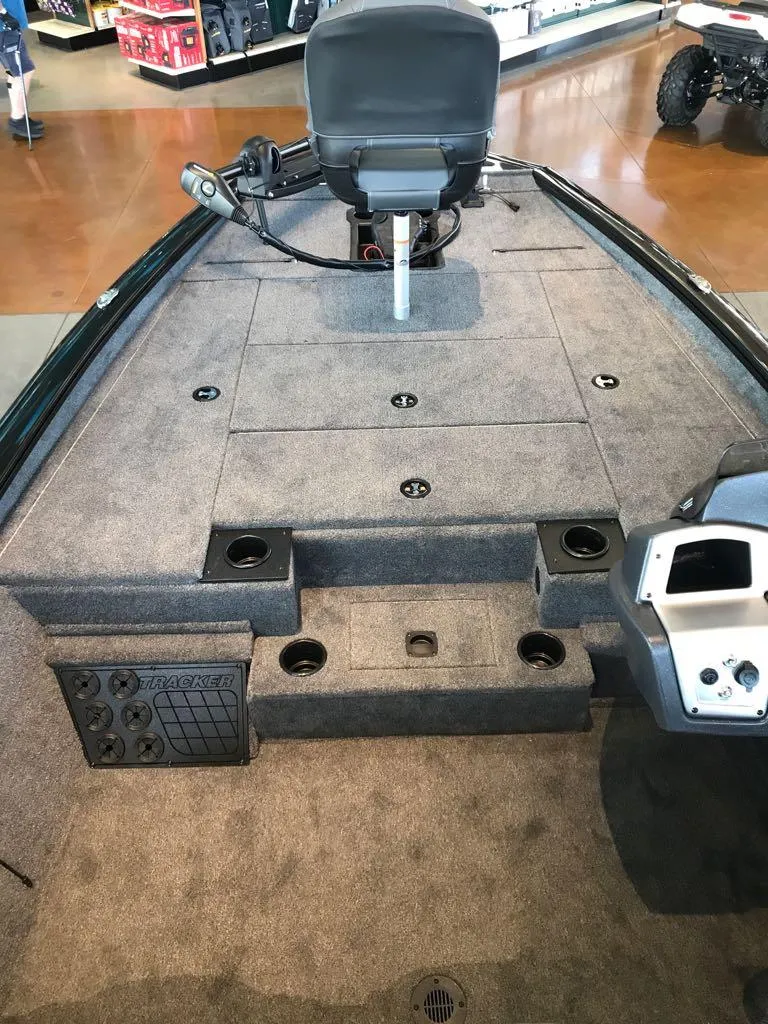 Slide: The Image of 2025 Tracker Pro Team 195 Tournament Edition boat interior with seating and storage compartments. - 6
