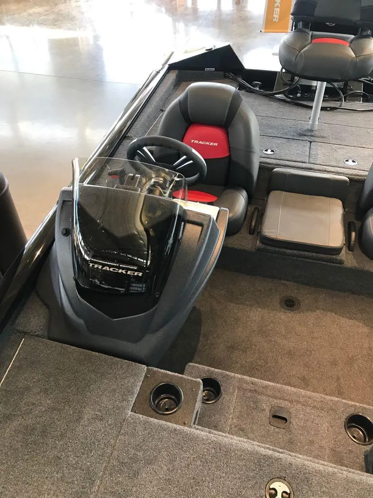 Slide: The Image of 2025 Tracker Pro Team 195 Tournament Edition boat interior with steering console and seating. - 8