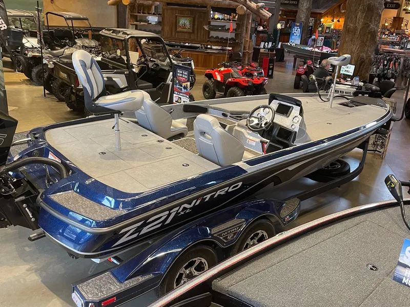 The Image of 2025 Nitro Z21 XL boat in showroom, featuring sleek design and modern seating. - 0