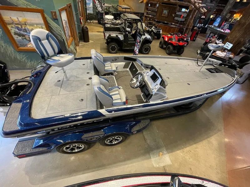 Slide: The Image of 2025 Nitro Z21 XL boat in showroom, featuring sleek design and modern seating. - 2