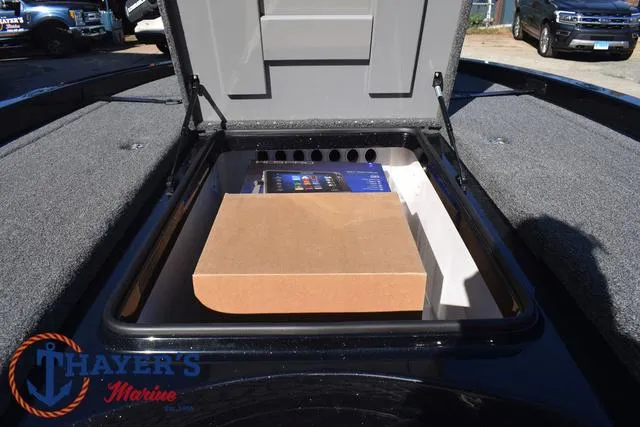 Slide: The Image of Open storage compartment in 2025 Caymas CX 21 PRO boat at Thayer's Marine. - 17
