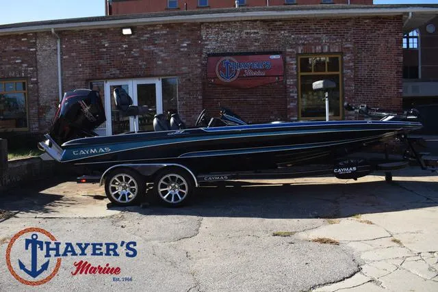 Slide: The Image of 2025 Caymas CX 21 PRO boat at Thayer's Marine dealership. - 2