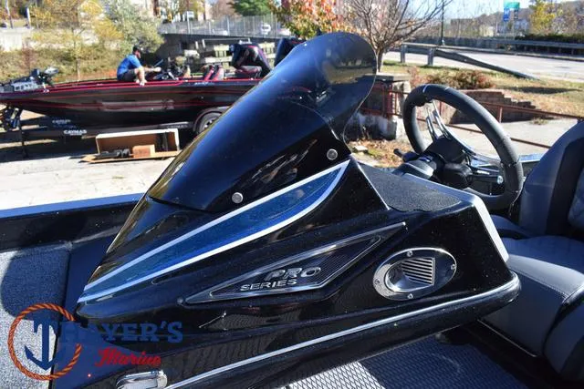 Slide: The Image of 2025 Caymas CX 21 PRO boat console with steering wheel and windshield. - 24