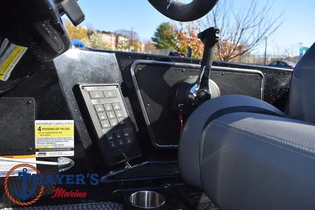 Slide: The Image of 2025 Caymas CX 21 PRO boat interior with control panel and seating. - 29