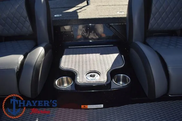 Slide: The Image of 2025 Caymas CX 21 PRO boat interior with cup holders and seating. - 31