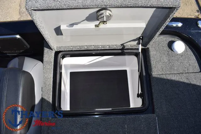 Slide: The Image of 2025 Caymas CX 21 PRO boat storage compartment with open lid. - 34