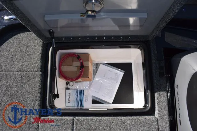 Slide: The Image of Storage compartment of 2025 Caymas CX 21 PRO boat with accessories and documents. - 35