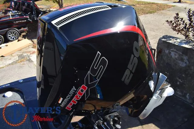 Slide: The Image of 2025 Caymas CX 21 PRO with Mercury Pro XS 250 engine, displayed at a marina. - 39