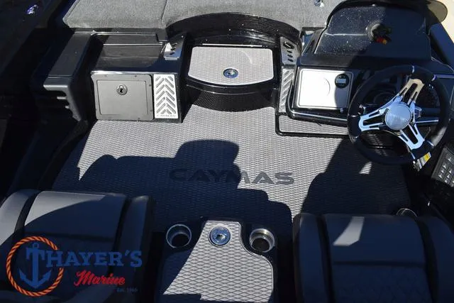 Slide: The Image of Caymas CX 21 PRO 2025 boat interior with steering wheel and branded flooring. - 40