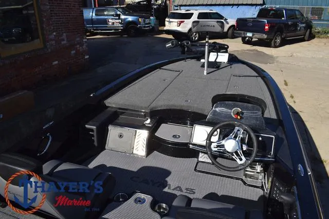 Slide: The Image of 2025 Caymas CX 21 PRO boat interior with steering wheel and seating. - 41