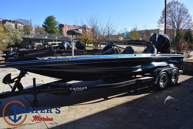 Slide: The Image of 2025 Caymas CX 21 PRO boat on trailer at Thayer's Marine dealership. - 8