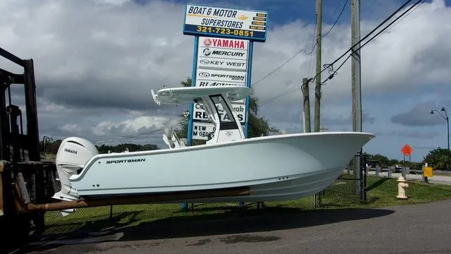 The Image of 2025 Sportsman Heritage 231 boat displayed at dealership with Yamaha engine. - 1