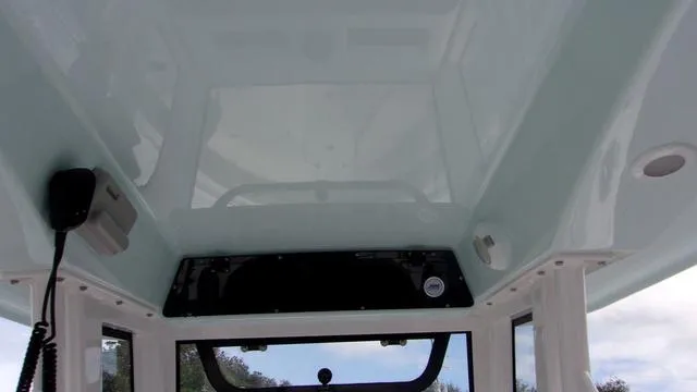 Slide: The Image of Interior view of 2025 Sportsman Heritage 231 boat's cabin ceiling with equipment. - 17