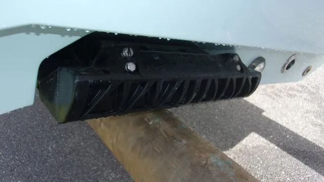 Slide: The Image of Close-up of a 2025 Sportsman Heritage 231 boat transducer mounted on the hull. - 3