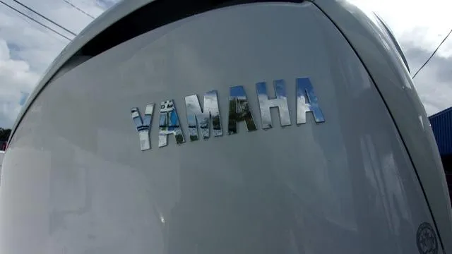 Slide: The Image of Close-up of Yamaha logo on a 2025 Sportsman Heritage 231 boat. - 4