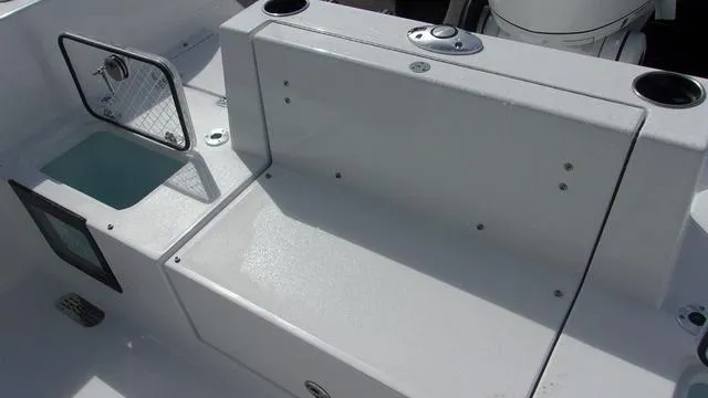 Slide: The Image of 2025 Sportsman Heritage 231 boat interior with seating and storage compartments. - 8