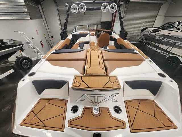 Slide: The Image of 2024 ATX Boats 24 TYPE-S interior with tan and black seating, modern design. - 3