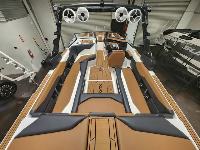 Slide: The Image of 2024 ATX Boats 24 TYPE-S interior with brown and black seating, modern design. - 4