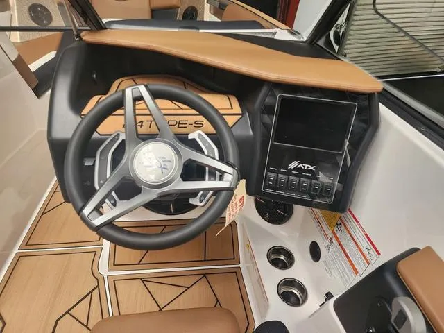 Slide: The Image of 2024 ATX Boats 24 TYPE-S dashboard with steering wheel and control panel. - 6