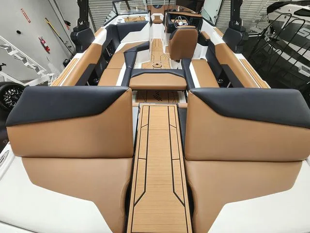 Slide: The Image of 2024 ATX Boats 24 TYPE-S interior with tan and black seating, modern design. - 9