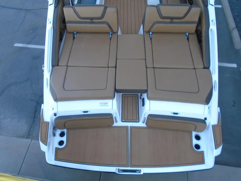 Slide: The Image of 2025 Yamaha Boats 275SD interior with tan seating and sleek design. - 23