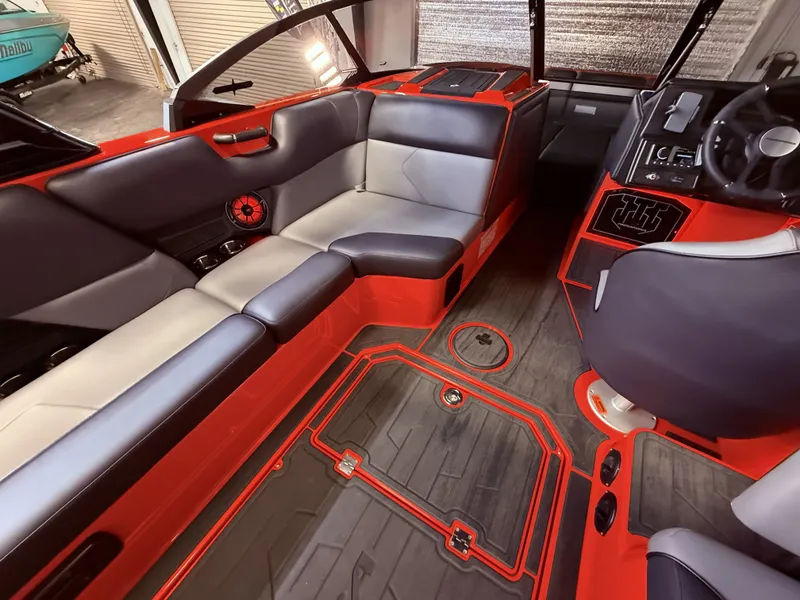 Slide: The Image of 2025 Moomba Tykon interior with modern seating and red accents. - 48