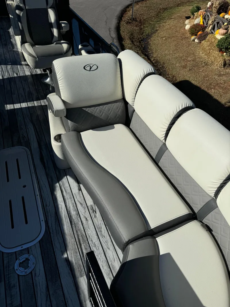 Slide: The Image of 2019 Veranda VP25RCT boat interior with plush seating and wood-style flooring. - 10