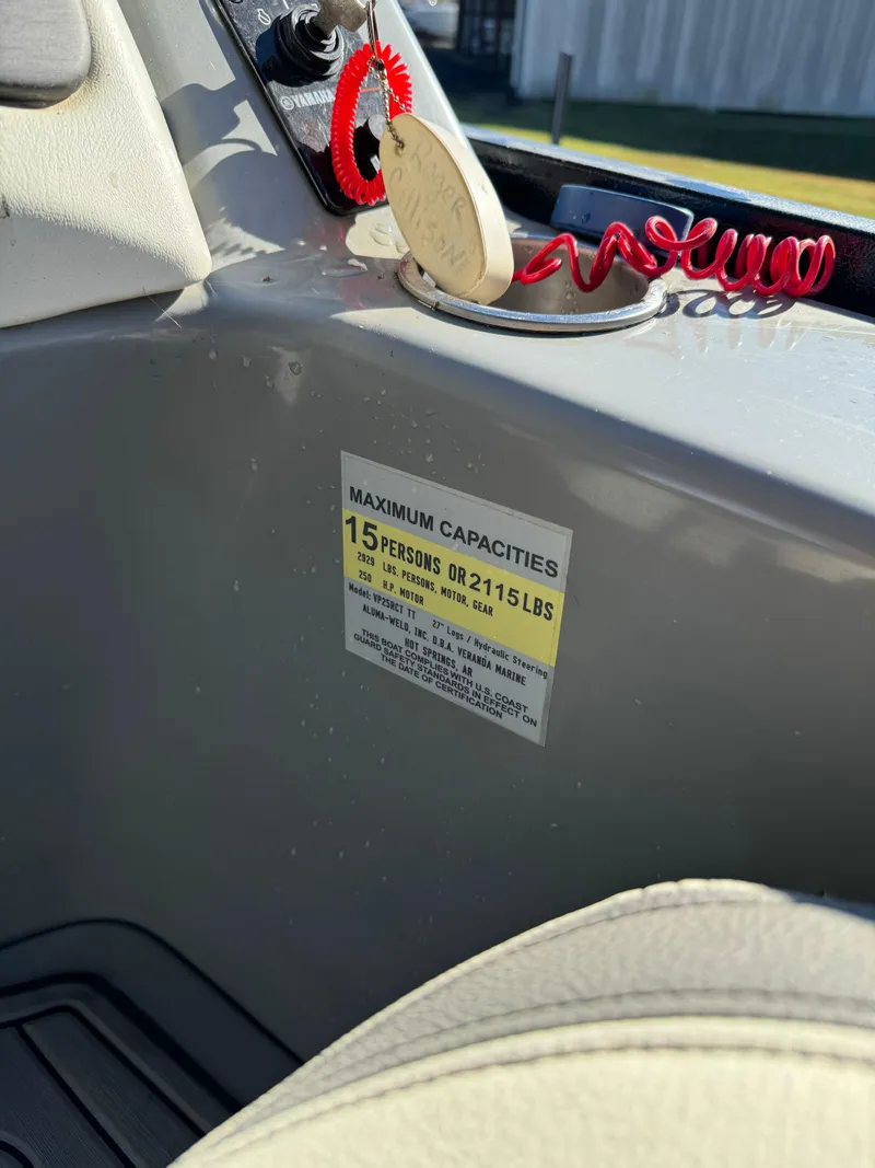 Slide: The Image of 2019 Veranda VP25RCT boat capacity label, maximum 15 persons or 2,115 lbs. - 11