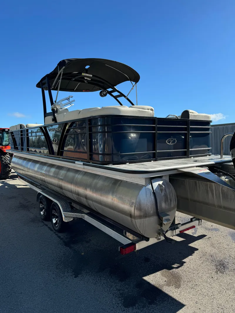 Slide: The Image of 2019 Veranda VP25RCT pontoon boat on trailer under clear blue sky. - 4