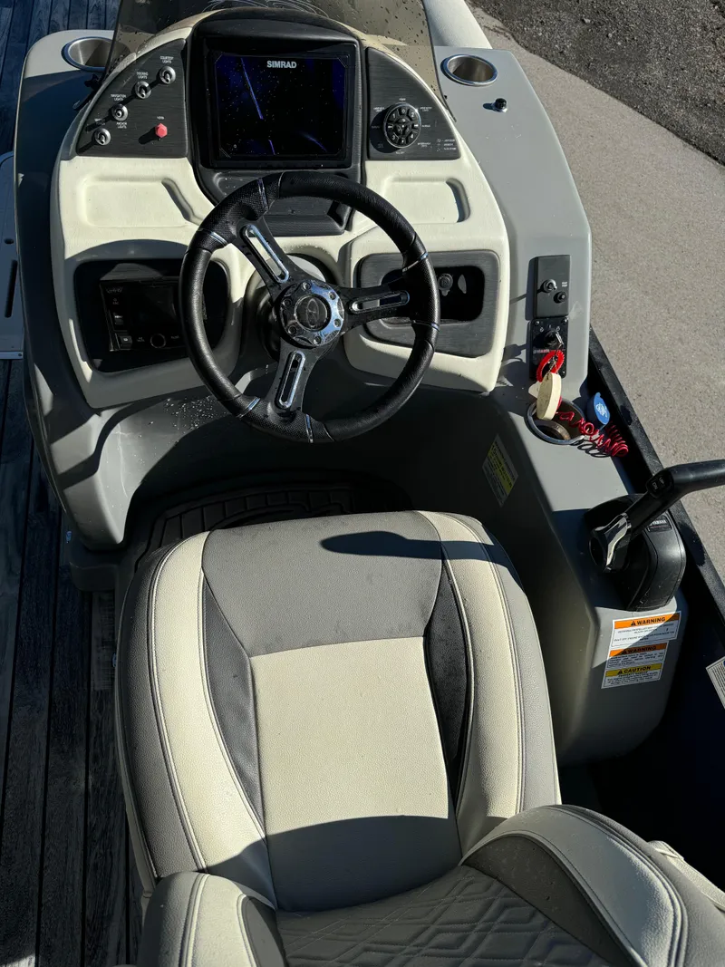Slide: The Image of 2019 Veranda VP25RCT boat helm with steering wheel and control panel. - 7