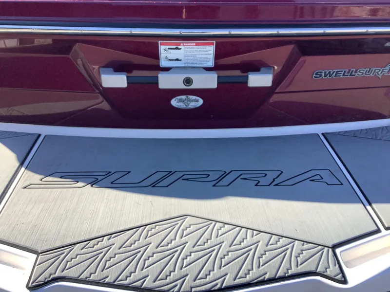 Slide: The Image of 2019 Supra SL450 boat with SwellSurf technology, rear view. - 11