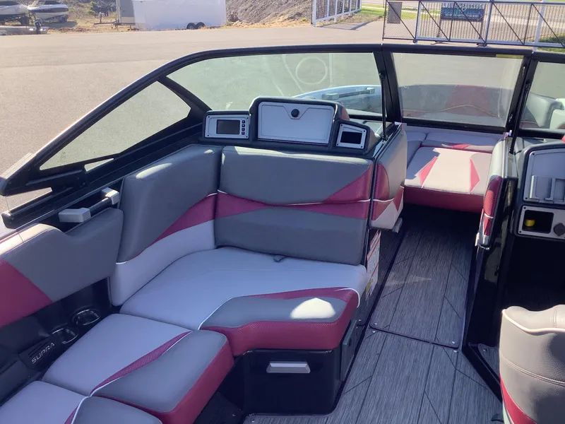Slide: The Image of 2019 Supra SL450 boat interior with modern seating and dashboard design. - 13