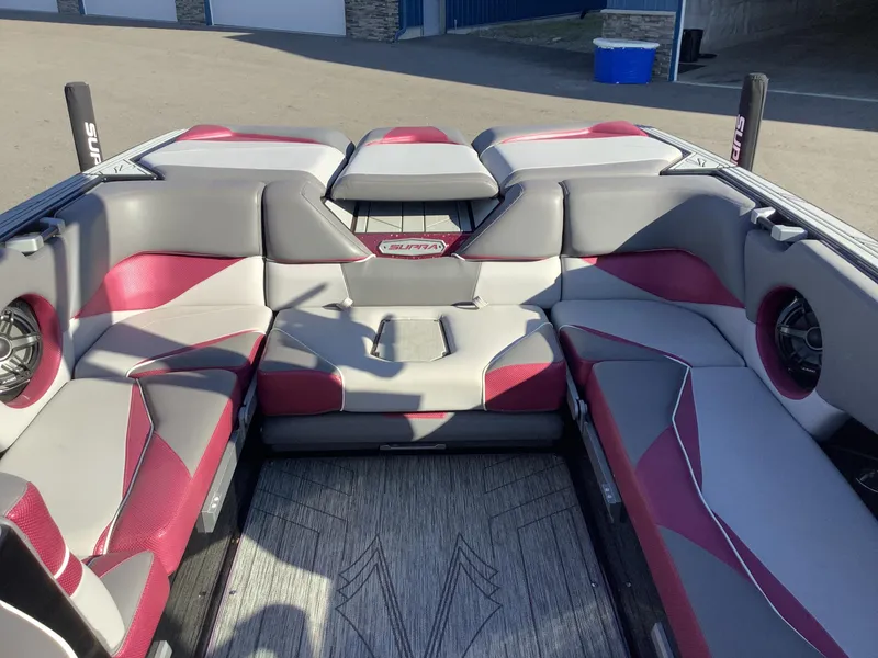 Slide: The Image of 2019 Supra SL450 boat interior with red and gray seating, modern design. - 15