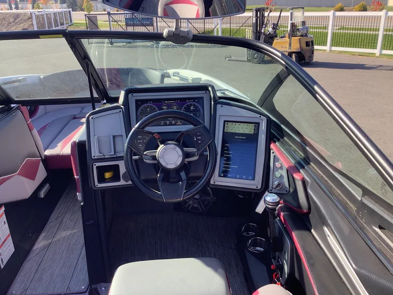 Slide: The Image of 2019 Supra SL450 boat cockpit with modern steering wheel and digital dashboard. - 18