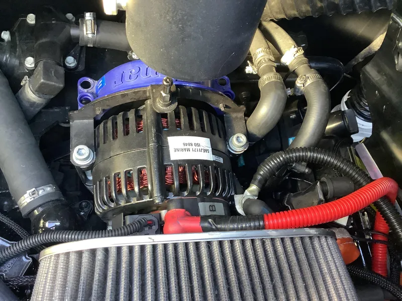 Slide: The Image of 2019 Supra SL450 engine compartment with alternator and wiring. - 34
