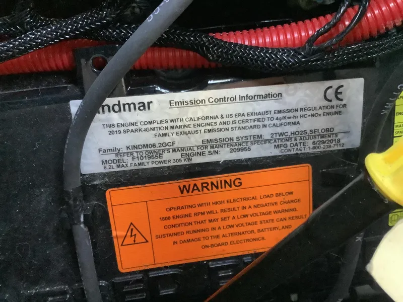 Slide: The Image of Emission control label on 2019 Supra SL450 engine with warning notice. - 35