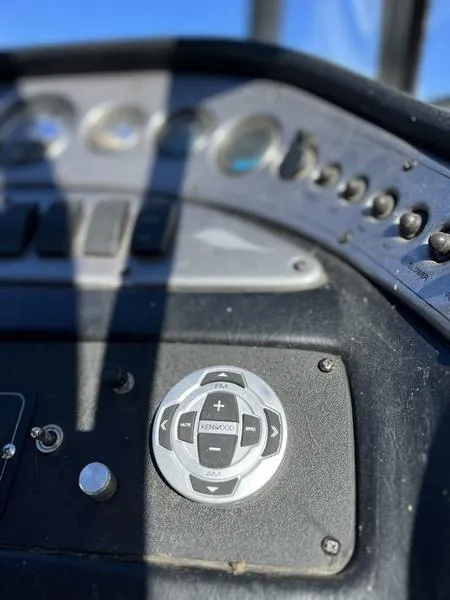 Slide: The Image of Close-up of 2002 Tigé 22i boat dashboard with Kenwood audio controls. - 27